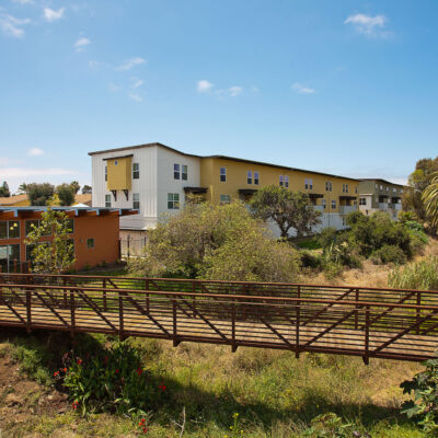 Property building exterior with bridge out front