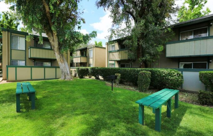 Property building exterior and picnic area with seating