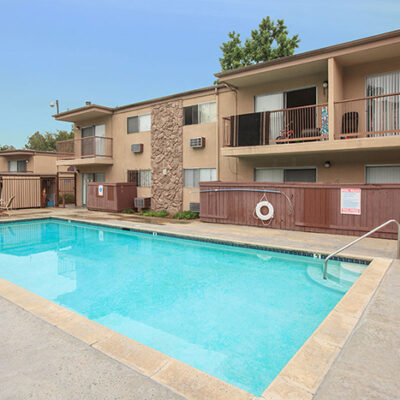 Property building exterior and pool with deck